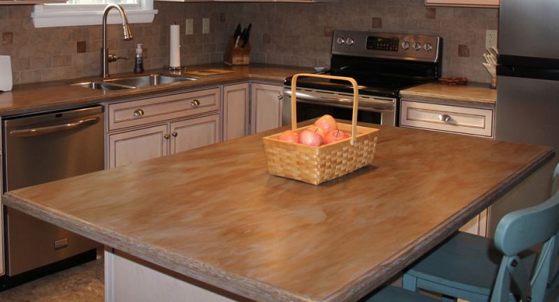 kitchen remodel with new center island and several apples placed within a rectangular basket