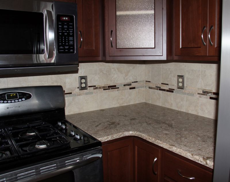kitchen countertops, appliances and newly renovated kitchen backsplash