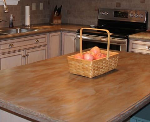 kitchen remodel with basket of apples sitting on the island